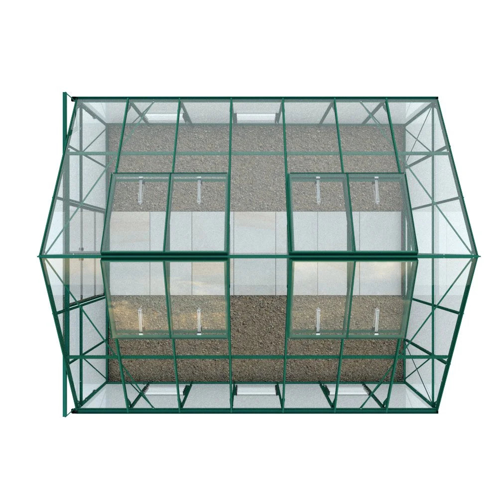Rhino Greenhouse with a green metal frame and transparent glass panels, viewed from above. It stands on a gravel surface. The structure is symmetrical and spacious, suitable for gardening.