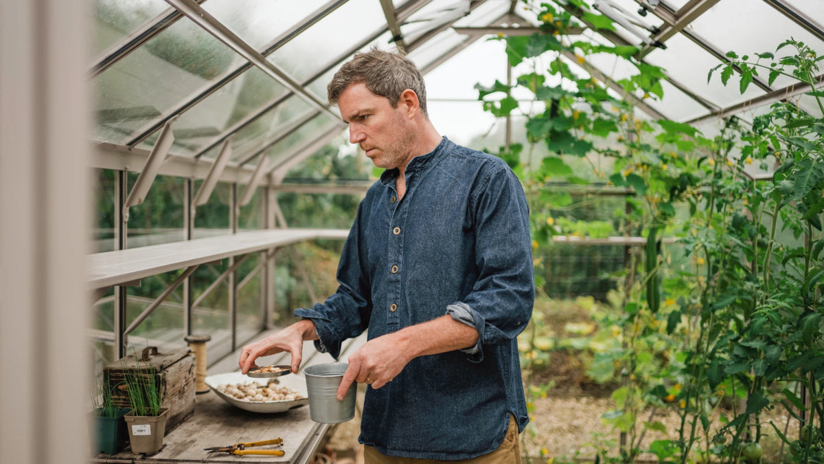 Gill inside his Rhino greenhouse
