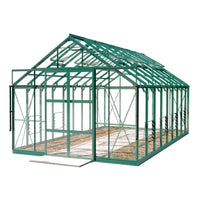 A green-frame Rhino Greenhouse stands with open sliding doors, featuring glass panels and roof vents, in a minimal, plain white setting.