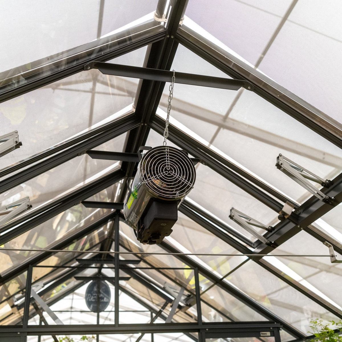 greenhouse heater hanging from roof of greenhouse