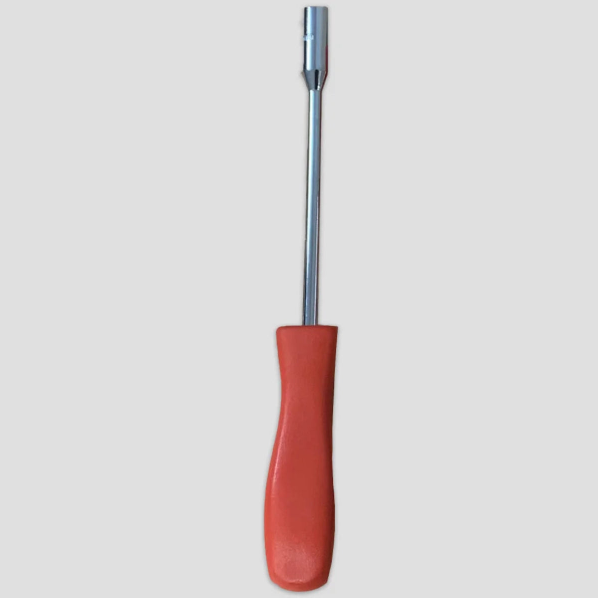 A red-handled screwdriver with a metallic shaft and hexagonal tip is centered against a plain, light gray background.